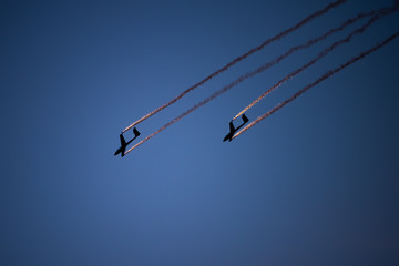 Airplane silhouette in the sky at sunset time during air show BIAS , Bucharest , Romania  