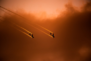 Airplane silhouette in the sky at sunset time during air show BIAS , Bucharest , Romania  