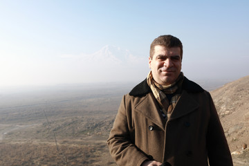 Man on background of Ararat Valley