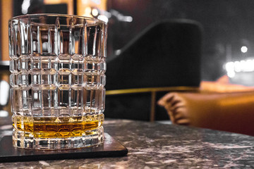 Male strong alcoholic drink. A glass of whiskey, brandy, bourbon, rum or tequila. Digest in the...