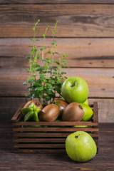 Set of green fruits for healthy diet and detox: apple, lime, kiwi, mango, carambola and mint.