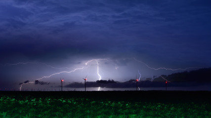 Lightning storm with windmill on the black sea 