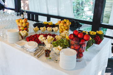 A meal decorated with different fruits at a feast.