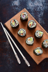 Sushi from cauliflower, avocado and tuna. Traditional Asian food. Diet healthy food concept. Cereal free. Gluten free. Dairy free. AIP Autoimmune Paleo.