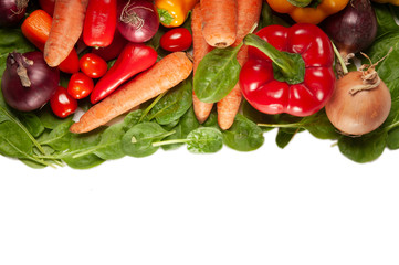 Colorful fresh and healthy vegetables on a white background with space for text on white at the bottom