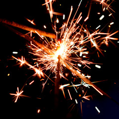 fireworks from sparkling Bengal lights in the dark, single