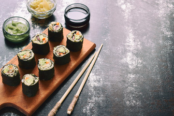 Sushi from cauliflower, avocado and tuna. Traditional Asian food. Diet healthy food concept. Cereal free. Gluten free. Dairy free. AIP Autoimmune Paleo.