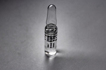 Black and white photo of an ampoule