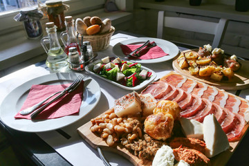 Serbian national cuisine with bacon, aspic, cornbread and cracklings