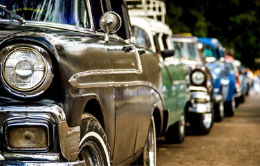 American old cars taxis waiting in the line for the tourists and clients