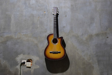 acoustic guitar on wall background