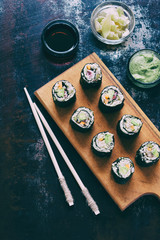 Sushi from cauliflower, avocado and tuna. Traditional Asian food. Diet healthy food concept. Cereal free. Gluten free. Dairy free. AIP Autoimmune Paleo.