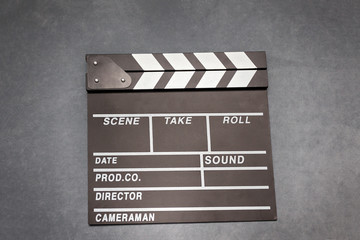 Movie clapper board on gray background - film concept