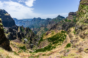Fototapeta na wymiar Trekking from Pico do Arieiro to Pico Ruivo, Madeira island, Portugal