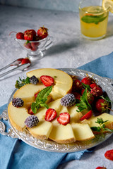 Tray with fruit and berries and lemonade