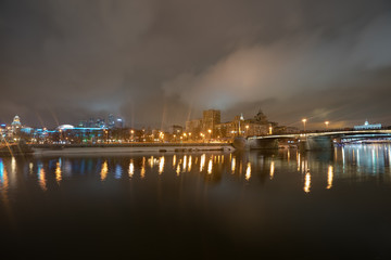 Image of Borodinsky bridge in Moscow at night winter time. MIBC (Moscow Imternational Business Center) in distance