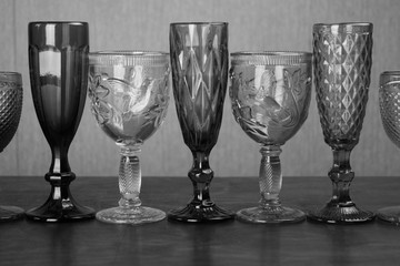 glasses in a row for alcoholic drinks black and white photo