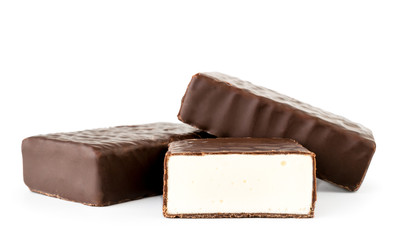 Candy souffle in chocolate and half on a white. Isolated.