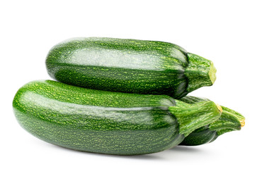 Heap of ripe zucchini on a white, isolated.