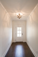 Modern new Construction Foyer front Entryway with Custom Lighting