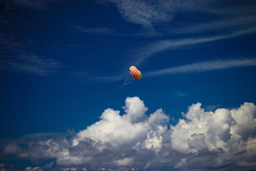 parachute in the sky with clouds