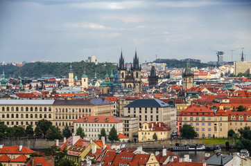 Panorama of Prague Old Town with red roofs , famous Charles bridge and Vltava river, Czech Republic.