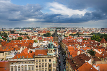 Naklejka na ściany i meble Panorama of Prague Old Town with red roofs , famous Charles bridge and Vltava river, Czech Republic.