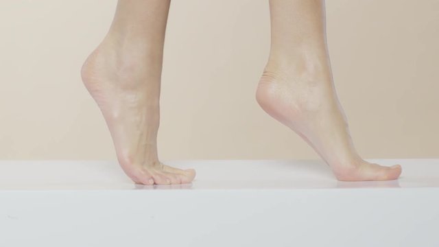 Female feet walking on a white surface, recorded Red Monstro and using Briese Focus 140 HMI.