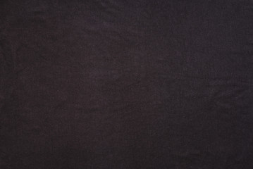 Old t-shirt texture, dark blue stretch fabric background. Analog photo simulation