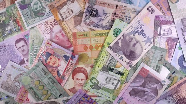 Various Middle East banknotes slow rotating. Money currency background. Stock video footage