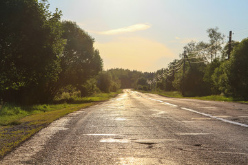Broken road at sunset
