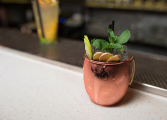  Green White Cocktail drink -beverage on a bar counter .  Selective focus on the foreground glass, Top view . Trendy stylish edit . Copy paste space for design concept service barmen concept