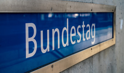 Obraz premium Bundestag Sign at the Bundestag Underground Station of the U55 in Berlin, Germany.