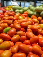 tomatoes huddled in the grocery store