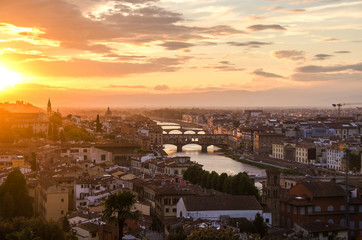 Fototapeta na wymiar Bridges of Florence over the Arno River at sunset, Italy