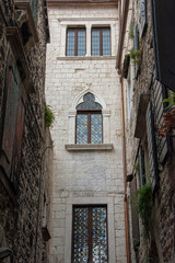 Croatia, Split - June 2018: View of the Cathedral tower though the narrow streets of the town