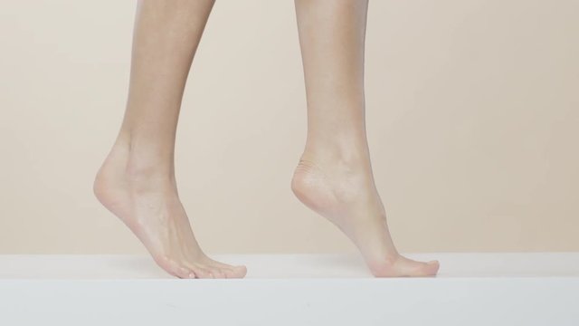 Female feet walking on a white surface, recorded Red Monstro and using Briese Focus 140 HMI.