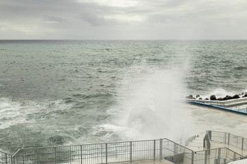 Ghost Tower / An image of sea spray covering a lifeguard lookout tower creating a ghostly...