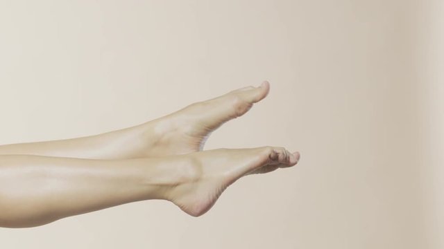 Female feet moving in the air, recorded Red Monstro and using Briese Focus 140 HMI