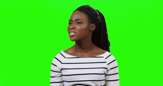 Close up of the young African American woman being surprides, upset and in perplexity on the alpha channel background.