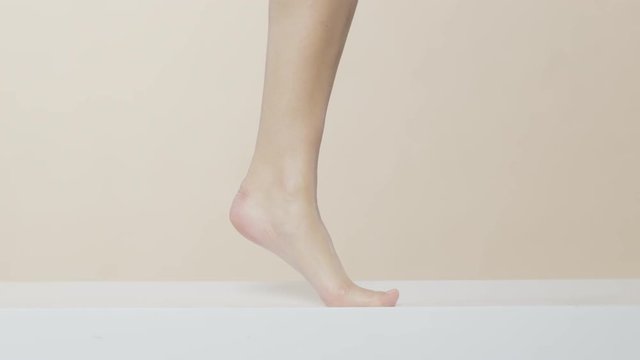 Female hands lubricating and touching beautiful legs, recorded Red Monstro and using Briese Focus 140 HMI