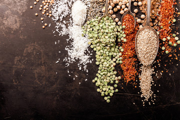 Spices and legumes on black background - 248051740