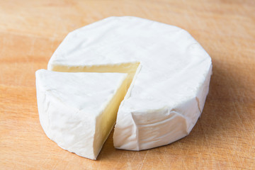 white brie cheese on the kitchen board