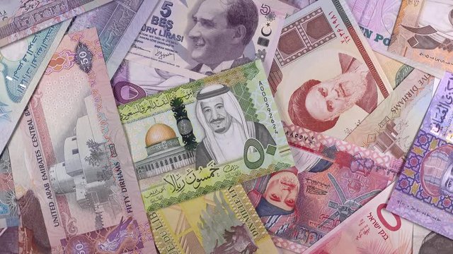 Middle East currencies notes slow rotating. Middle East economy, investment, market. 4K stock video footage