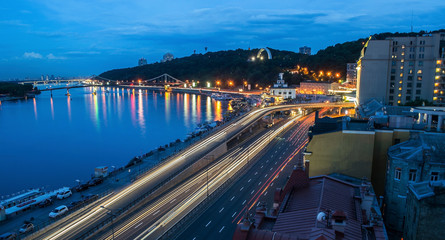 Car light trails and urban landscape. Moving car with blur light through city at night. Kiev