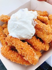 Chicken chips chicken nuggets deep fried with sour cream dipping sauce fast food grounded chicken fingers bread crumps 