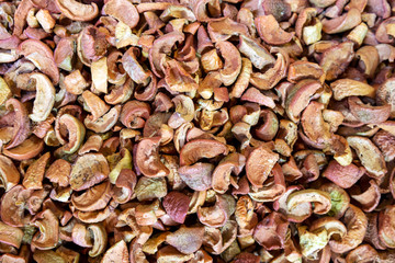 Dried apples at market, background.