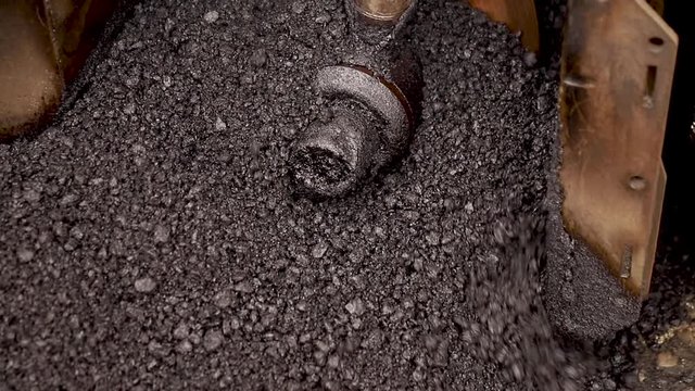 Hot tar mixed asphalt with stones. Best construction materials. bitumen