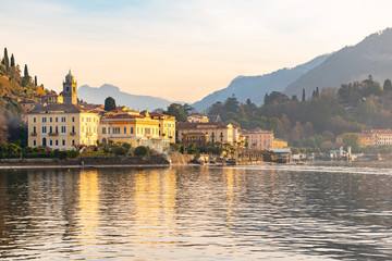 Fototapeta na wymiar Beautiful view of the Bellagio resort town seen from Lake Como on sunset, Lombardy, Italy