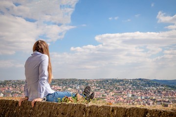 Fototapeta premium Young woman looking at Wurzburg panorama, Germany
